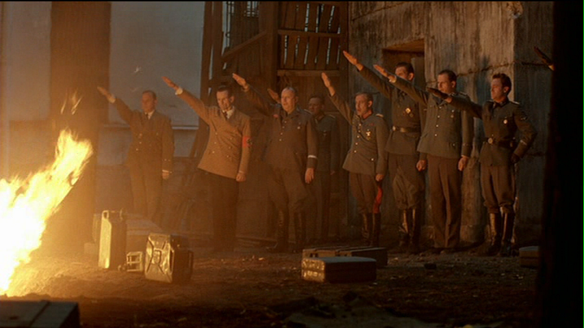 Those left behind salute the burning corpse of the Führer