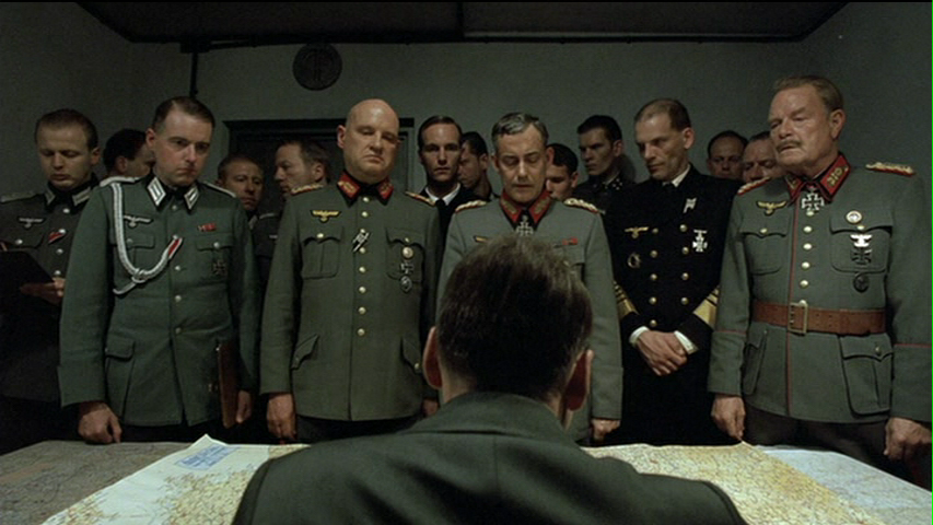 Hitler's generals stand dumbfounded as the Führer plans counterattacks with nonexistant divisions